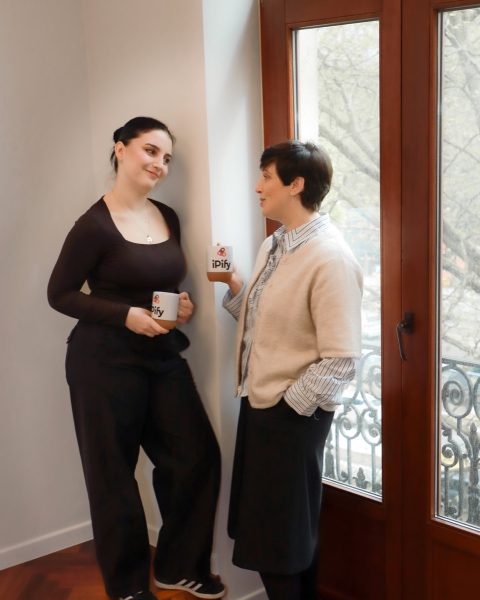 Two iPify colleagues listening and discussing a case